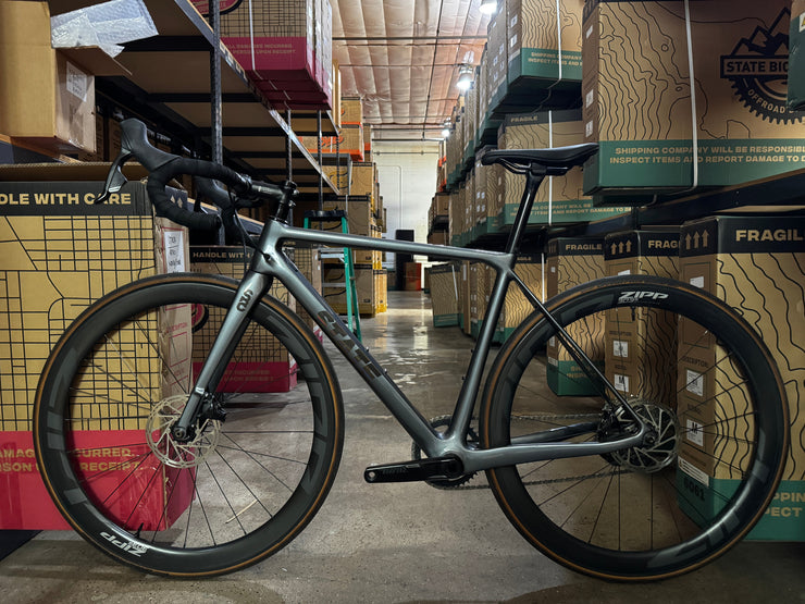 #1276 - Undefeated Road Carbon | Graphite (Size 48cm, Used Condition – Team Rider Bike)