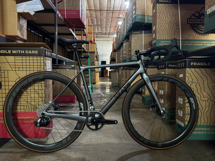 #1276 - Undefeated Road Carbon | Graphite (Size 48cm, Used Condition – Team Rider Bike)